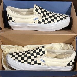 Vans Black and White Checkerboard Slip-Ons